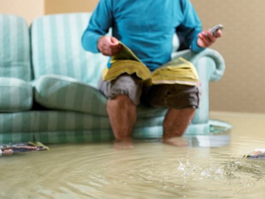 person in flooded house